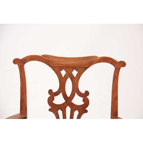 1092 - AN 18TH CENTURY COUNTRY MADE ELM CHIPPENDALE STYLE COMMODE ARMCHAIR with shaped top rail above a pie... 