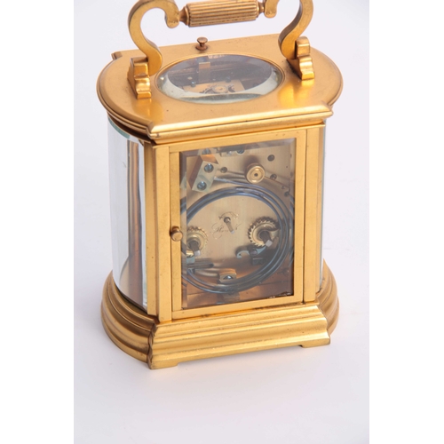 810 - A LATE 19th CENTURY FRENCH REPEATING CARRIAGE CLOCK the gilt bow sided case inset with bevelled glas... 