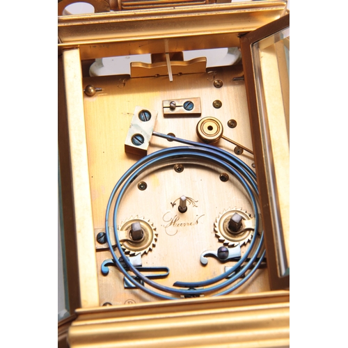 810 - A LATE 19th CENTURY FRENCH REPEATING CARRIAGE CLOCK the gilt bow sided case inset with bevelled glas... 