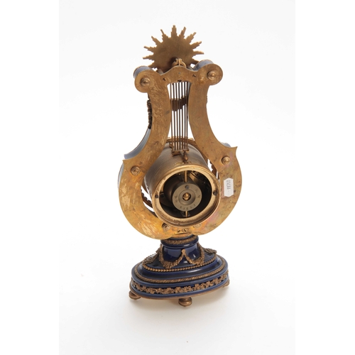 815 - A LATE 19th CENTURY FRENCH ORMOLU MOUNTED MYSTERY CLOCK the lyre-shaped cobalt blue porcelain case s... 