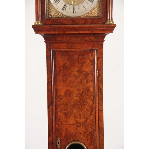 822 - JOHN MAY, LONDON A GEORGE I BURR WALNUT LONGCASE CLOCK having a caddy top above pierced sound frets ... 