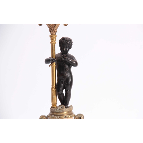 829 - A 19TH CENTURY FRENCH ALABASTER, GILT BRASS AND BRONZE MOUNTED MANTEL GARNIATURE SET the ornate cent... 