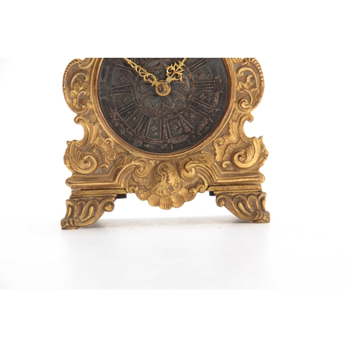 844 - E. THOMAS, PARIS A LATE 19th CENTURY FRENCH GILT TRAVELLING CLOCK the foliate engraved case surmount... 