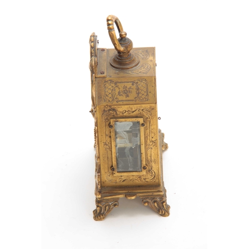 844 - E. THOMAS, PARIS A LATE 19th CENTURY FRENCH GILT TRAVELLING CLOCK the foliate engraved case surmount... 