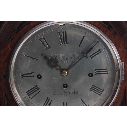 873 - M. BEAL, SHEFFIELD A GOTHIC OAK CASED TRIPLE FUSEE BRACKET CLOCK the case with gothic carved panels ... 