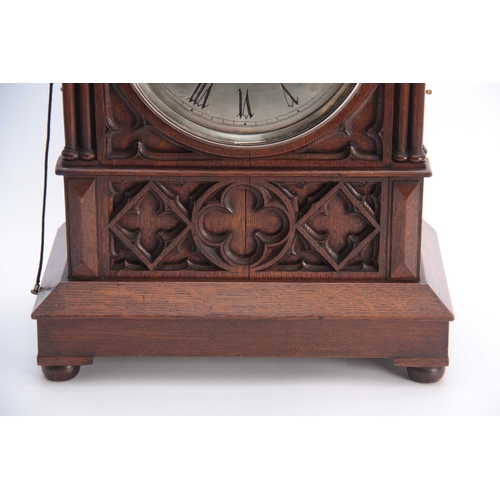 873 - M. BEAL, SHEFFIELD A GOTHIC OAK CASED TRIPLE FUSEE BRACKET CLOCK the case with gothic carved panels ... 