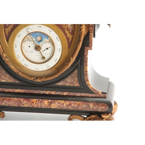 898 - A LATE 19th CENTURY FRENCH ORMOLU MOUNTED BLACK AND ROUGE MARBLE CALENDAR CLOCK surmounted by an orm... 