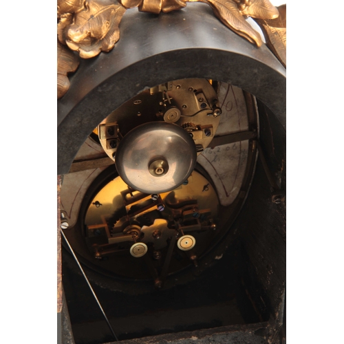 898 - A LATE 19th CENTURY FRENCH ORMOLU MOUNTED BLACK AND ROUGE MARBLE CALENDAR CLOCK surmounted by an orm... 