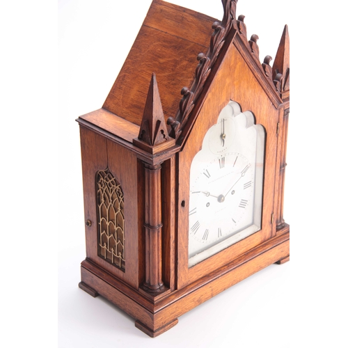 900 - LE PLASTRIER & YOUNG, LONDON. A MID 19th CENTURY GOTHIC OAK BRACKET CLOCK the architectural oak case... 