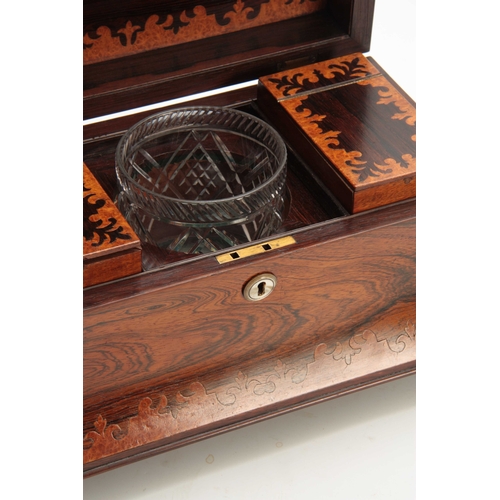 907 - A LATE REGENCY ROSEWOOD AND BIRDSEYE MAPLE CUT MARQUETRY SARCOPHAGUS TEA CADDY  the hinged lid enclo... 