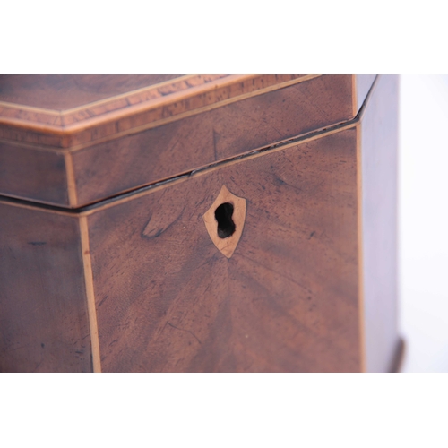 909 - A GEORGE III FLAMED MAHOGANY OCTAGONAL SHAPED TEA CADDY with cross-banded and boxwood edges, having ... 