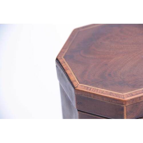 909 - A GEORGE III FLAMED MAHOGANY OCTAGONAL SHAPED TEA CADDY with cross-banded and boxwood edges, having ... 