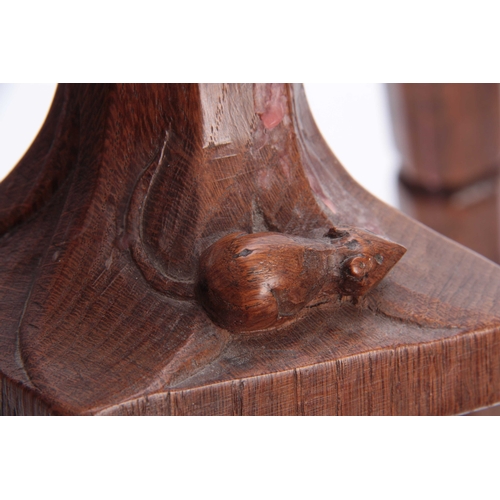 936 - A PAIR OF EARLY ROBERT MOUSEMAN THOMPSON OAK CANDLESTICKS with leaf carved sconces and facetted ring... 