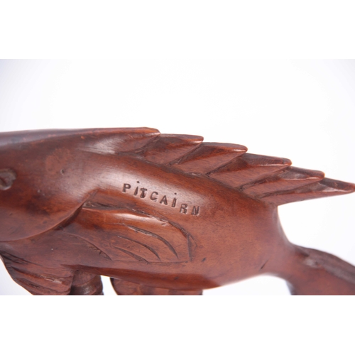 945 - A PAIR OF 19TH CENTURY HARDWOOD PITCAIRN SOUTH PACIFIC CARVED BOOKENDS DEPICTING FISH both carved Pi... 