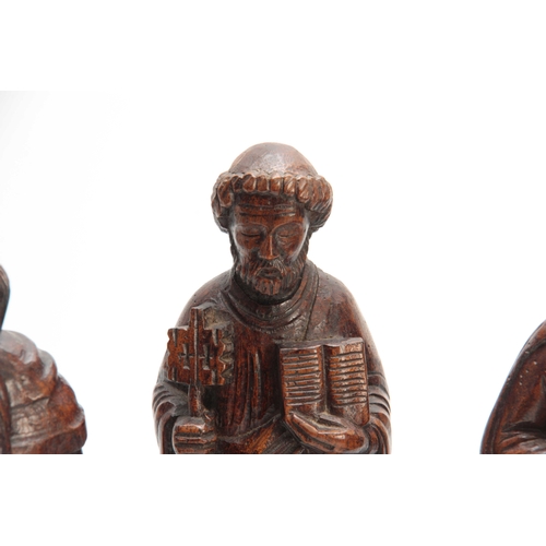 946 - THREE 18TH CENTURY STYLE CARVED RELIGIOUS FIGURES 34cm high and smaller.