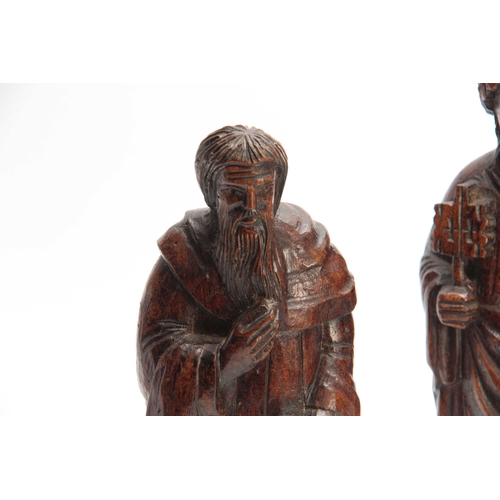 946 - THREE 18TH CENTURY STYLE CARVED RELIGIOUS FIGURES 34cm high and smaller.