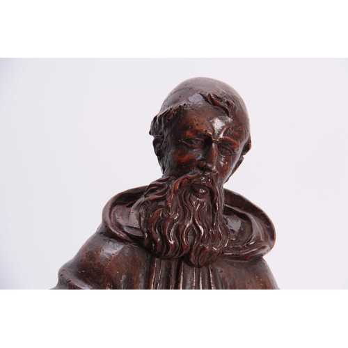 947 - A 17TH CENTURY CARVED LIMEWOOD FIGURE OF A SAINT finely carved with a good patination 48cm high.