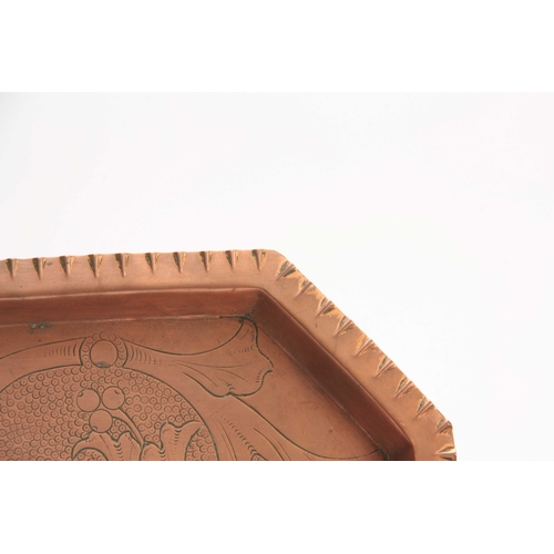 956 - AN ARTS AND CRAFTS COPPER TRAY with moulded edge and clipped corners, having foliage engraved centre... 