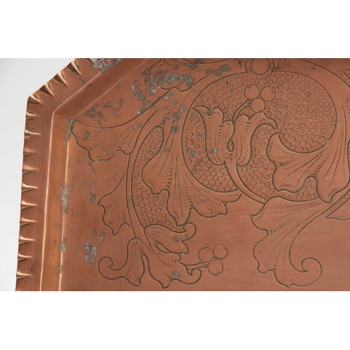 956 - AN ARTS AND CRAFTS COPPER TRAY with moulded edge and clipped corners, having foliage engraved centre... 