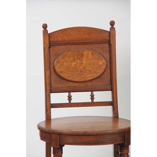 966 - A PAIR OF ARTS AND CRAFTS OAK HALL CHAIRS with raised oval panel on the backrest and matching oval s... 