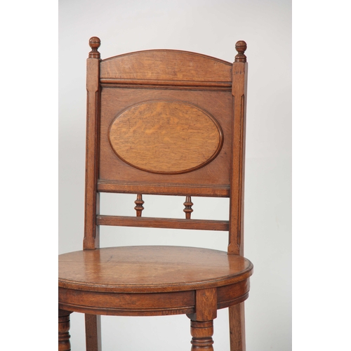 966 - A PAIR OF ARTS AND CRAFTS OAK HALL CHAIRS with raised oval panel on the backrest and matching oval s... 