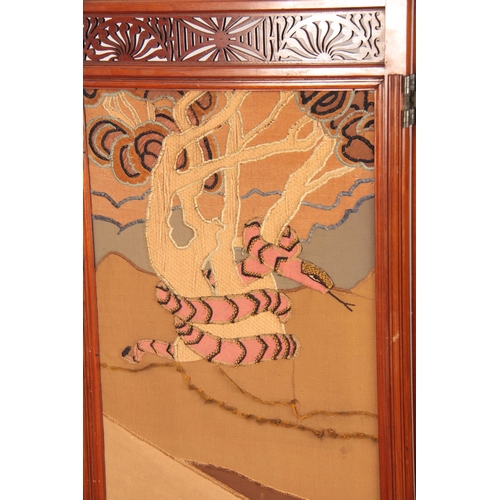 967 - AN ARTS AND CRAFTS WALNUT EMBROIDERED SCREEN having pierced stylised fret work top, with initials EW... 