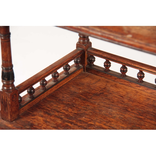 968 - LAMB, MANCHESTER A LATE 19TH CENTURY ARTS AND CRAFTS OAK THREE TIER WHATNOT with ebonised turned col... 