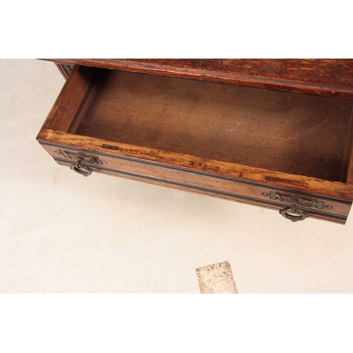 968 - LAMB, MANCHESTER A LATE 19TH CENTURY ARTS AND CRAFTS OAK THREE TIER WHATNOT with ebonised turned col... 