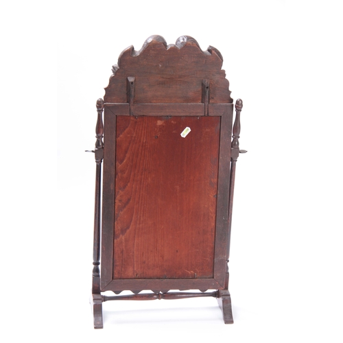 978 - A QUEEN ANNE WALNUT TOILET MIRROR WITH LEAF AND SHELL CARVED CREST, moulded frame and turned column ... 