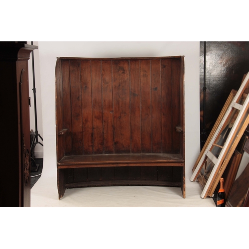 989 - A GEORGE III BOWED ELM TAVERN SETTLE having planked back and thick-cut seat joined by enclosed sides... 