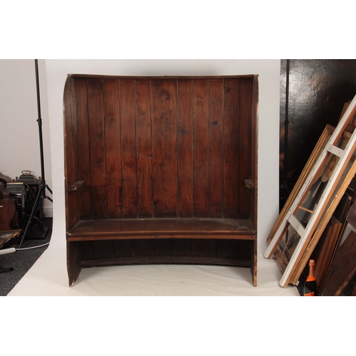 989 - A GEORGE III BOWED ELM TAVERN SETTLE having planked back and thick-cut seat joined by enclosed sides... 