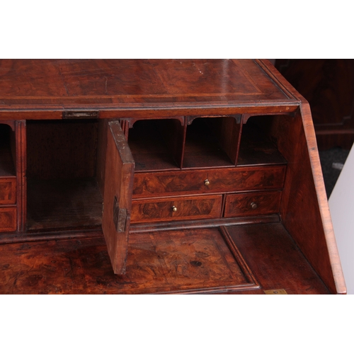 992 - A GOOD WILLIAM AND MARY HERRING-BANDED AND BURR WALNUT BUREAU having angled hinged fall revealing a ... 