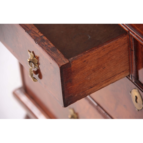 992 - A GOOD WILLIAM AND MARY HERRING-BANDED AND BURR WALNUT BUREAU having angled hinged fall revealing a ... 