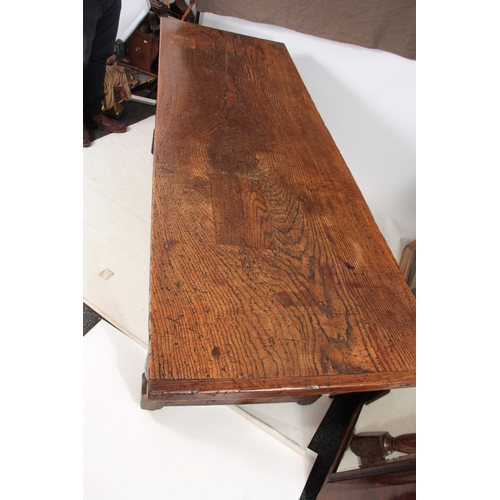 997 - A GOOD LATE 17TH CENTURY OAK REFECTORY / FARMHOUSE TABLE with one-piece plank top, above a plain fri... 