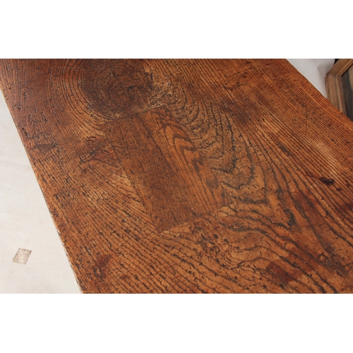 997 - A GOOD LATE 17TH CENTURY OAK REFECTORY / FARMHOUSE TABLE with one-piece plank top, above a plain fri... 