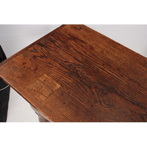 997 - A GOOD LATE 17TH CENTURY OAK REFECTORY / FARMHOUSE TABLE with one-piece plank top, above a plain fri... 