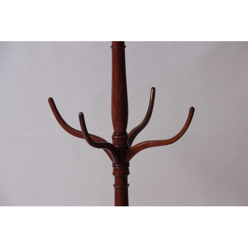 998 - A LATE GEORGIAN THREE TIER MAHOGANY COAT AND HAT STAND with curved hooks and tapering ring turned sl... 