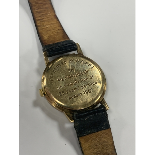 626 - A GENTLEMANS 9ct GOLD LONGINES WRIST WATCH on a black leather strap, having a silvered dial with bat... 