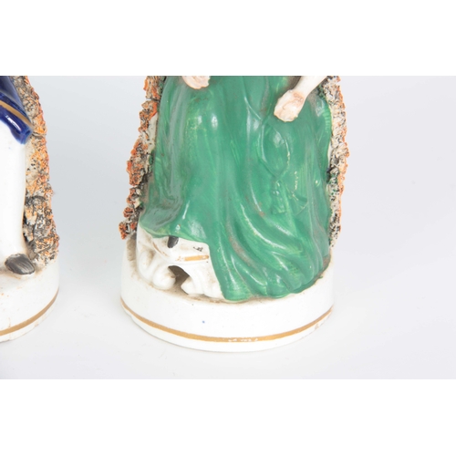 105 - A PAIR OF 19TH CENTURY STAFFORDSHIRE FIGURES depicting Victoria and Albert 17cm high.