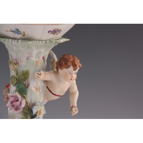 114 - TWO 19TH CENTURY DRESDEN PORCELAIN COMPOTE CENTREPIECES with figural cherub bases and pierced basket... 