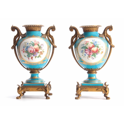 119 - A PAIR OF 19TH CENTURY FRENCH ORMOLU MOUNTED SEVRES STYLE URN-SHAPED VASES with square raised bases ... 