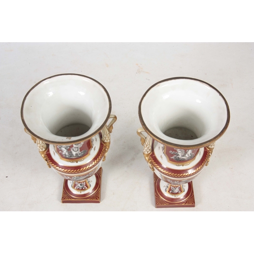 122 - A PAIR OF 19TH CENTURY PARIS HARD PORCELAIN CAMPAGNE SHAPED VASES with gilded rust panels and border... 