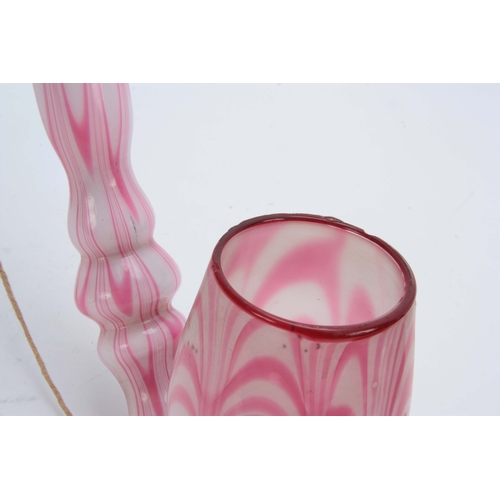 18 - A LARGE 19TH CENTURY STOURBRIDGE GLASS PIPE of twisted pink and opaque design 50cm overall.