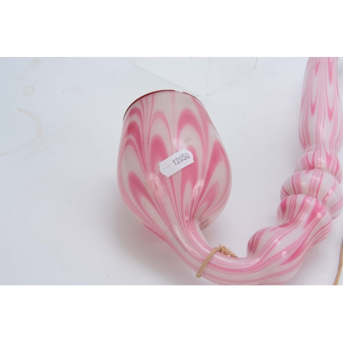 18 - A LARGE 19TH CENTURY STOURBRIDGE GLASS PIPE of twisted pink and opaque design 50cm overall.