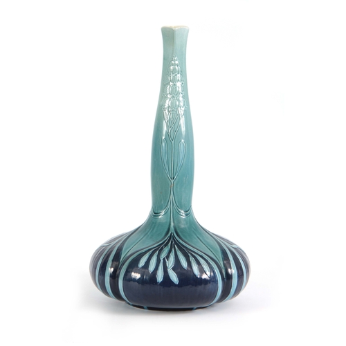 55 - AN EARLY 20TH CENTURY VILLEROY AND BOCH ART NOUVEAU VASE with tube lined decoration having quatrefoi... 