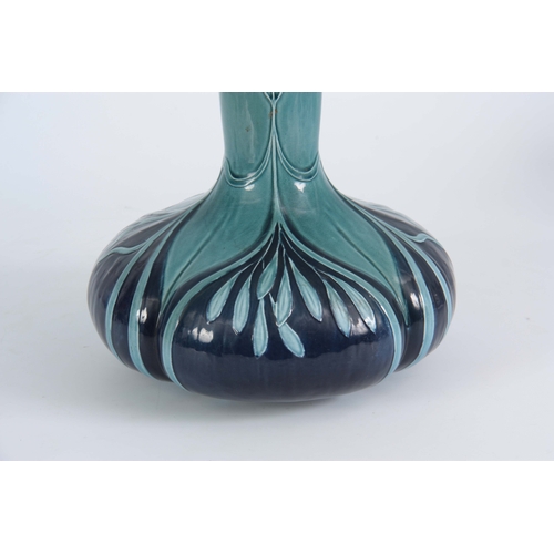 55 - AN EARLY 20TH CENTURY VILLEROY AND BOCH ART NOUVEAU VASE with tube lined decoration having quatrefoi... 