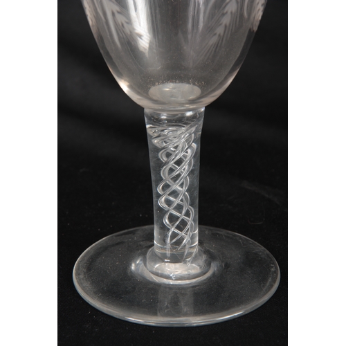 6 - AN 18TH CENTURY STYLE GLASS GOBLET Circa 1880 with a flat foot, multi-spiral air twist stem and flar... 