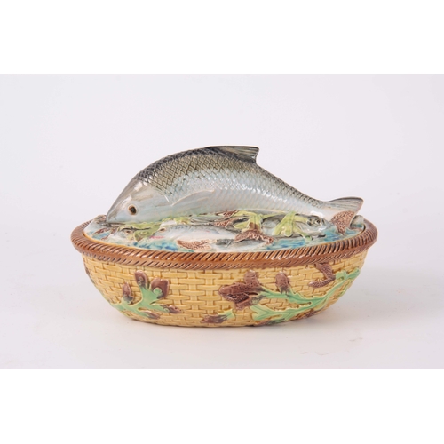 66 - A LATE 19th CENTURY MAJOLICA SARDINE DISH AND COVER IN THE MANNER OF GEORGE JONES the oval lid surmo... 