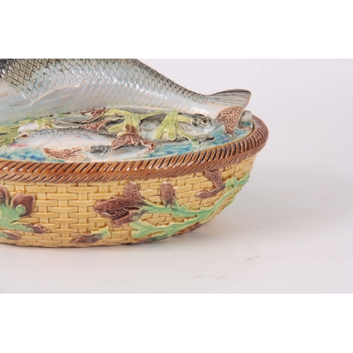 66 - A LATE 19th CENTURY MAJOLICA SARDINE DISH AND COVER IN THE MANNER OF GEORGE JONES the oval lid surmo... 