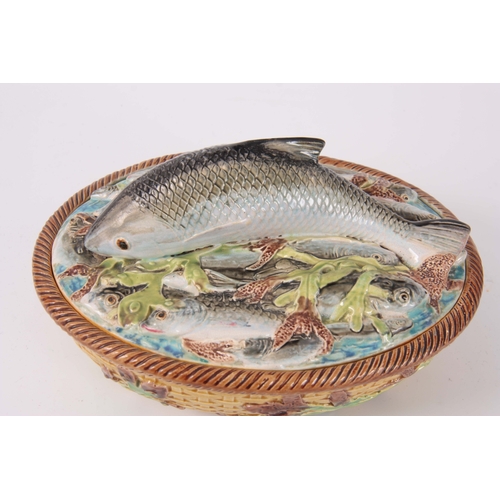 66 - A LATE 19th CENTURY MAJOLICA SARDINE DISH AND COVER IN THE MANNER OF GEORGE JONES the oval lid surmo... 